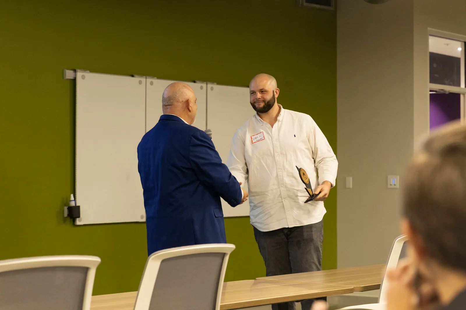 Founder receiving an award at a Launchpad cohort graduation