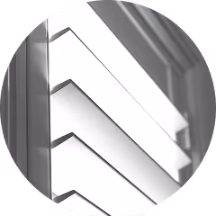 Close-up of a modern white window shutter with angled slats casting shadows.