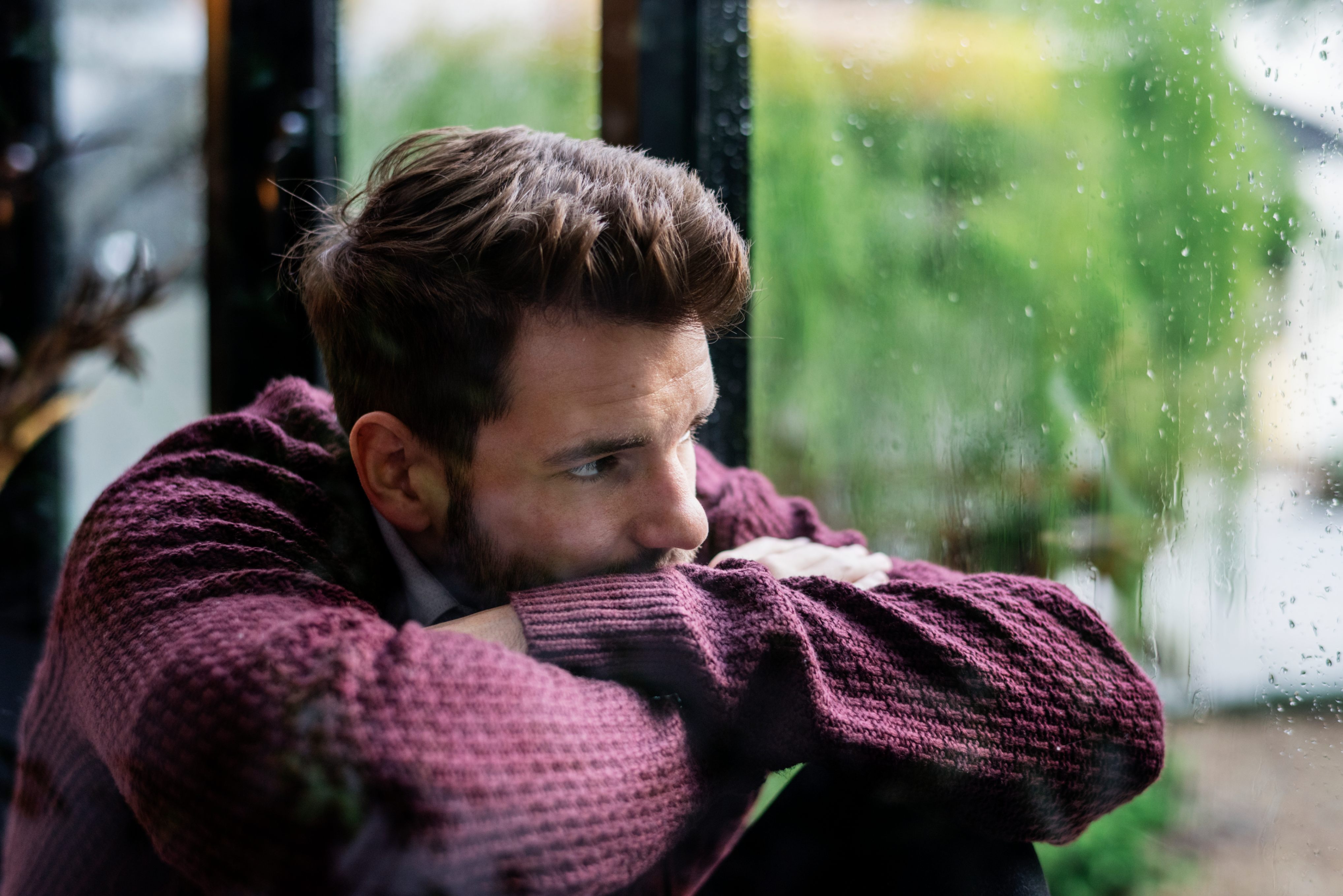 Man looking through the window