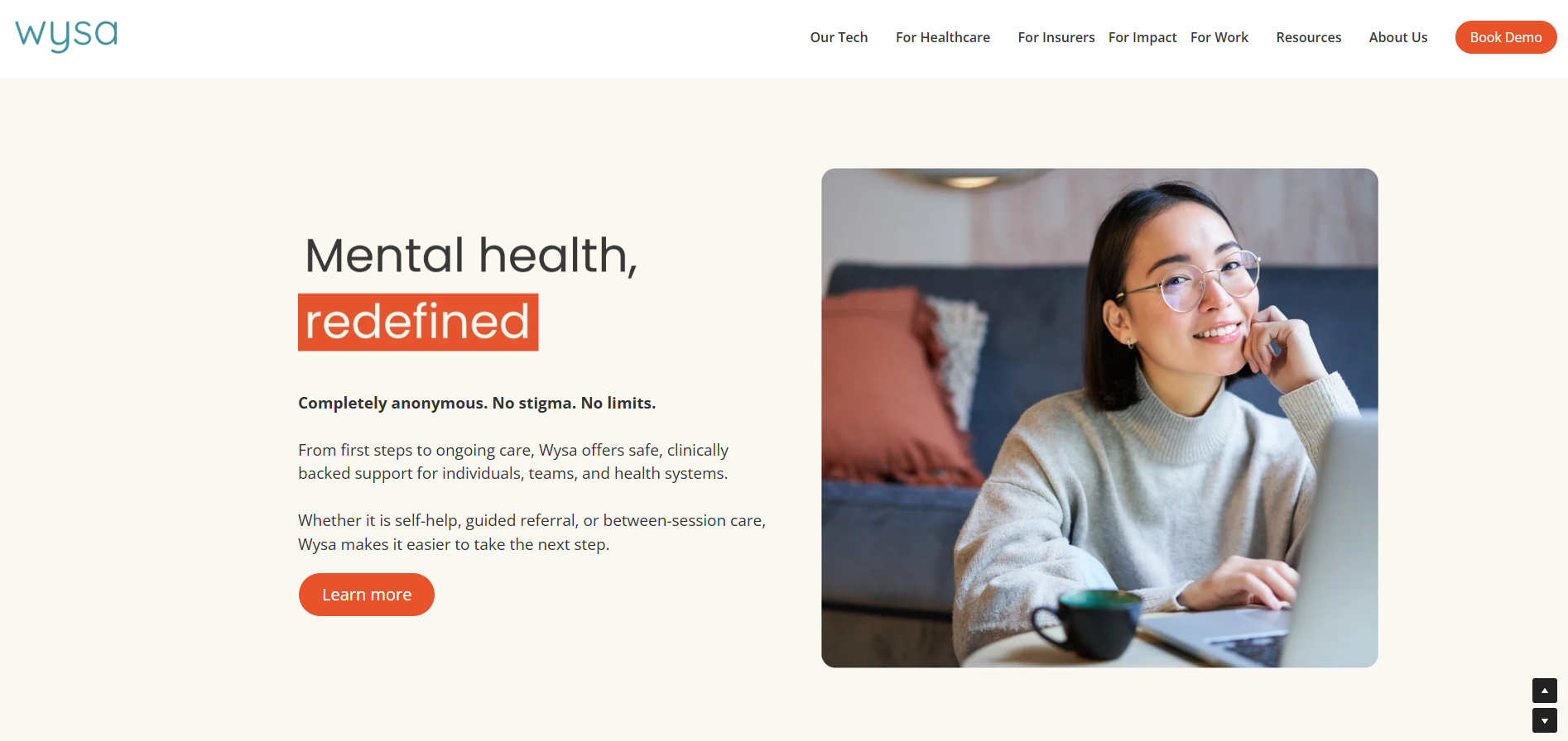 Wysa homepage highlighting anonymous AI-guided emotional support, self-help tools, and mental wellness resources with a user working on a laptop.