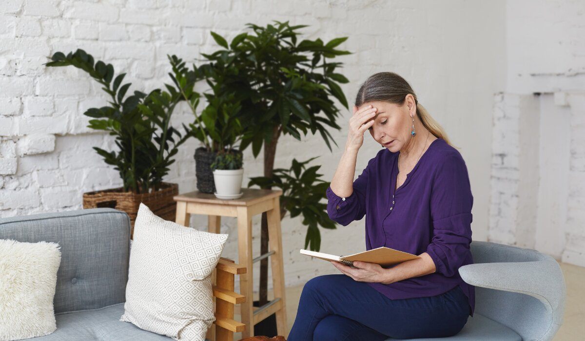 Woman feeling overwhelmed while looking for someone to talk to online about her problems