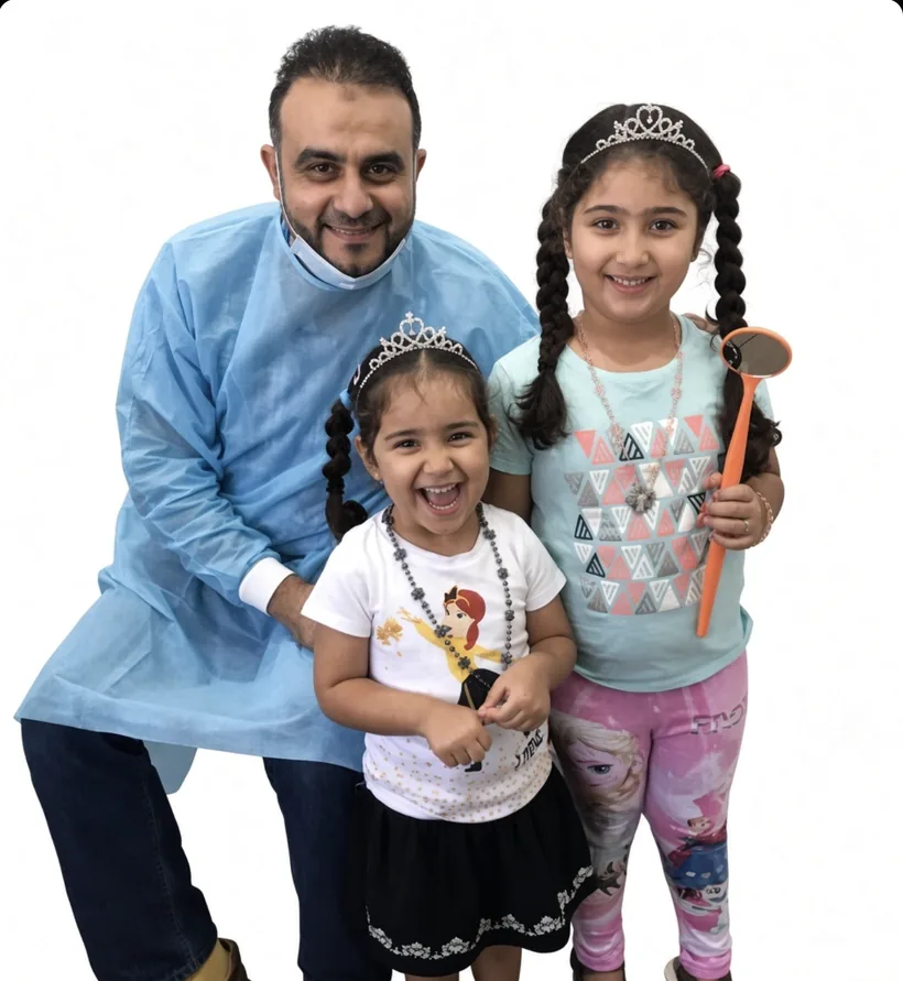 Dr Belal Aly at Berala Dental with two young patients.