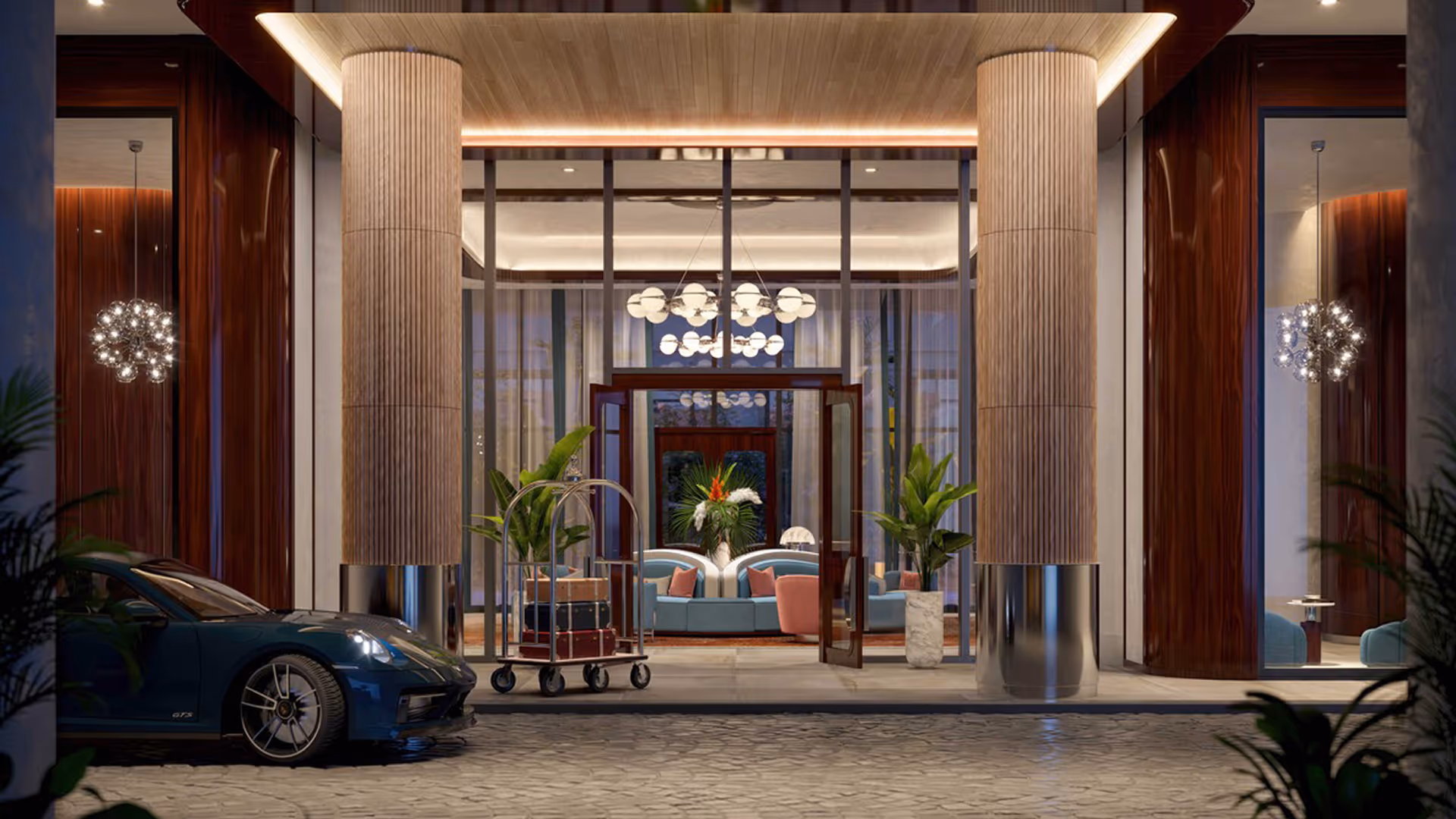 Hotel entrance with a luxury car, luggage cart, large pillars, and a stylish lobby seating area, Mr. C Miami – Coconut Grove, luxury hotel.