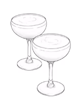 Two coupe glasses filled with a foamy cocktail, side by side on a white background.