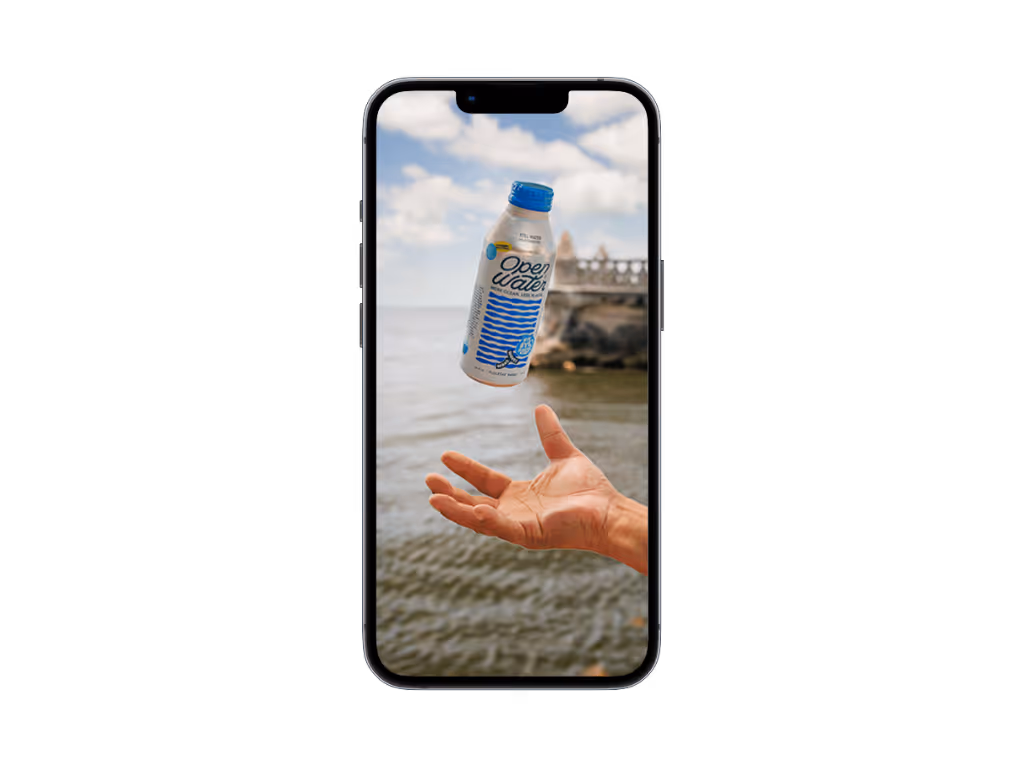 A clean professional mockup of a smartphone centered on a black background, displaying the edited image of the Open Water bottle floating above a hand.