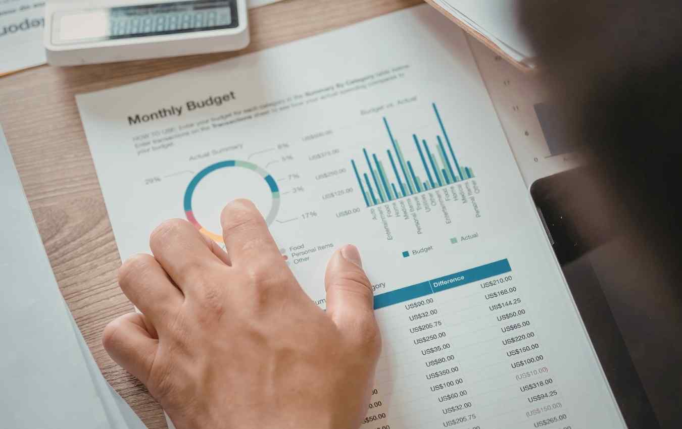 image of financial reports being reviewed