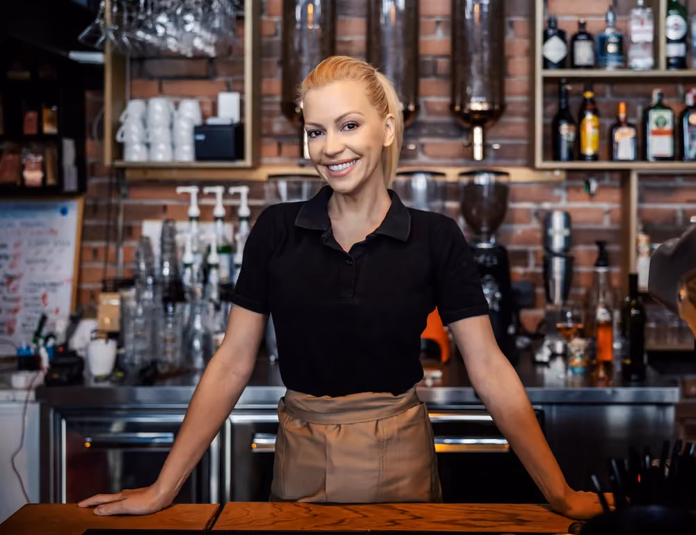 Bartender behind the bar at 11pm, when Ferry calculates the shift's tips automatically.