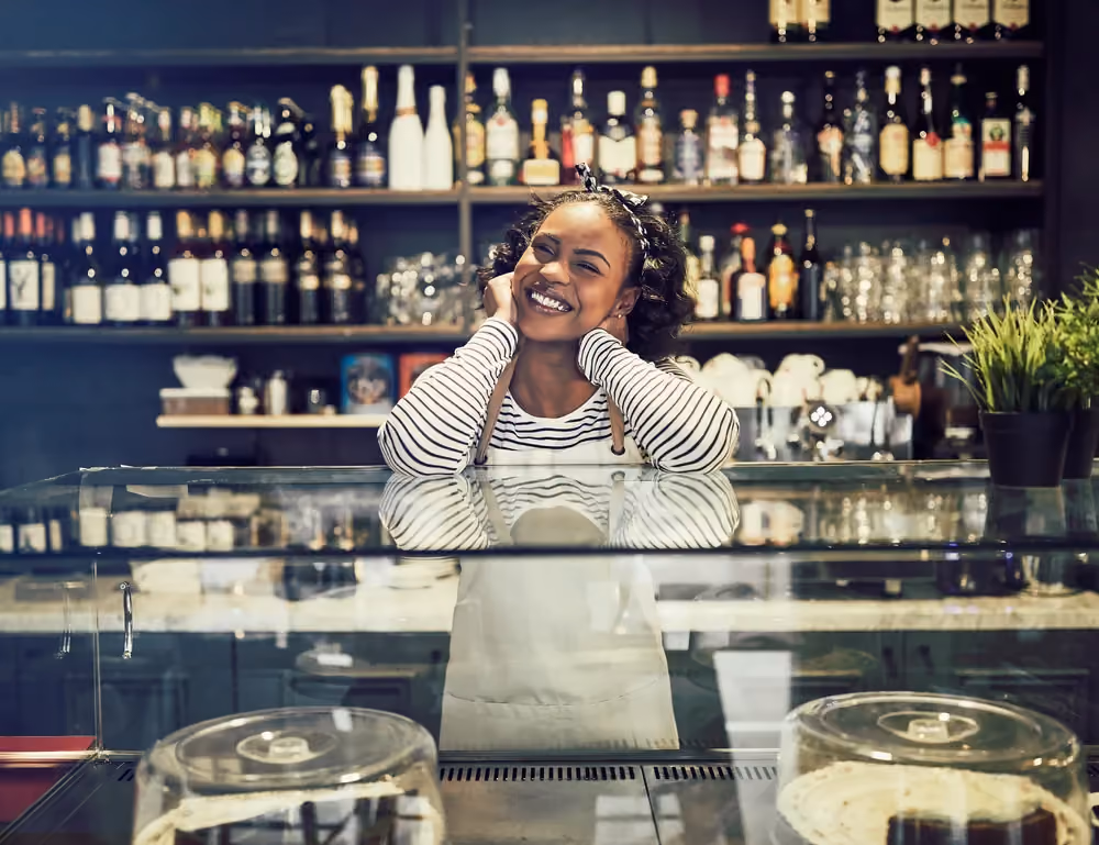 Café worker behind the counter whose tips land on a Ferry Pay Card at shift end.
