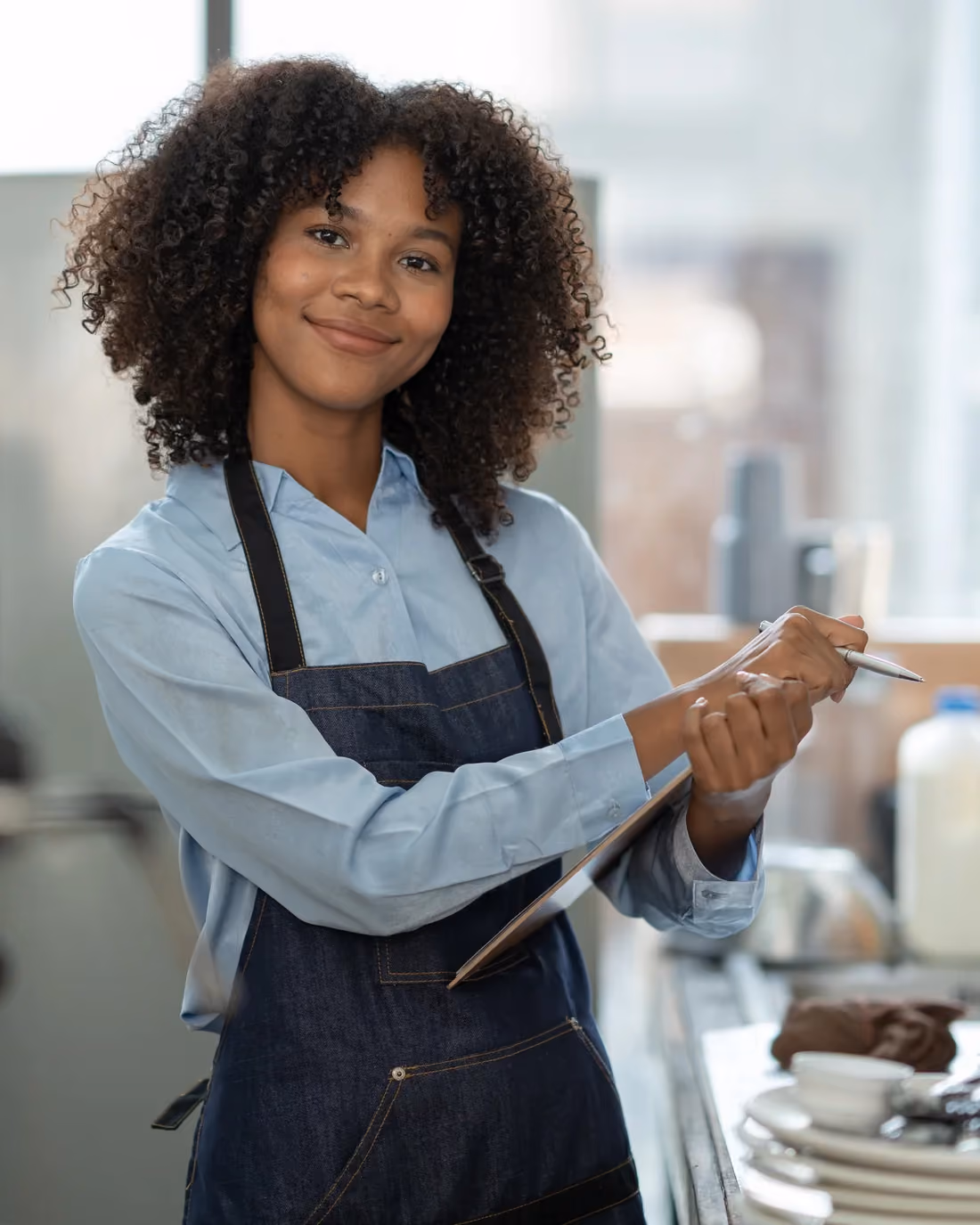 Server in an apron at a full-service restaurant that pools tips across servers, bartenders and support staff.