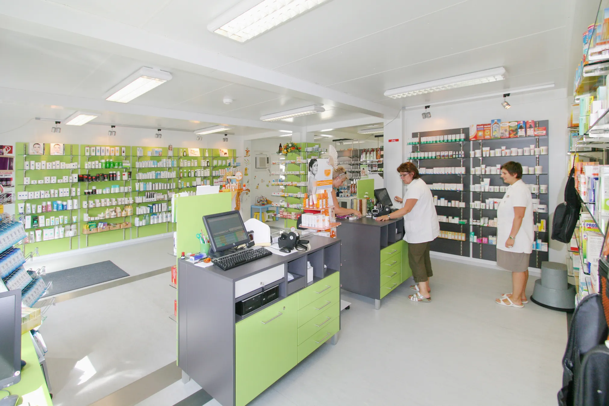 Top down layout of a modular shop container with shelving, checkout counter and customer areas
