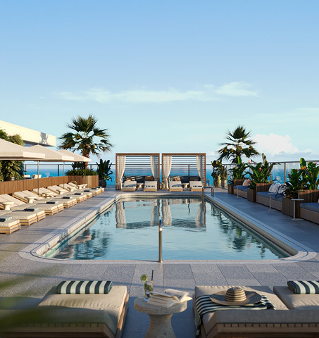 Piscina na cobertura com espreguiçadeiras, cabanas, palmeiras e um céu azul límpido, Mr. C Miami – Coconut Grove, hotel de luxo.