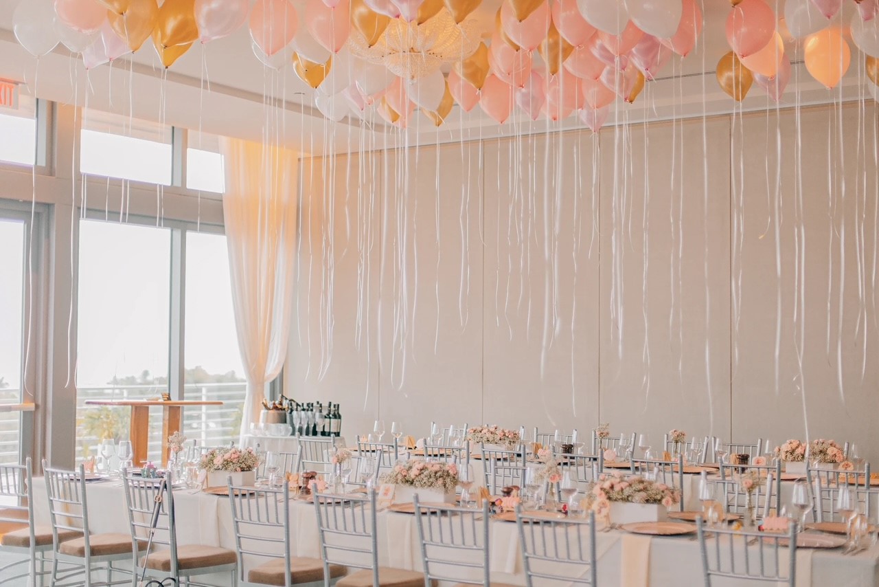 Starlight Ballroom interior decorated for an event with a pale pink ceiling installation. Mr. C Miami – Coconut Grove, luxury hotel.