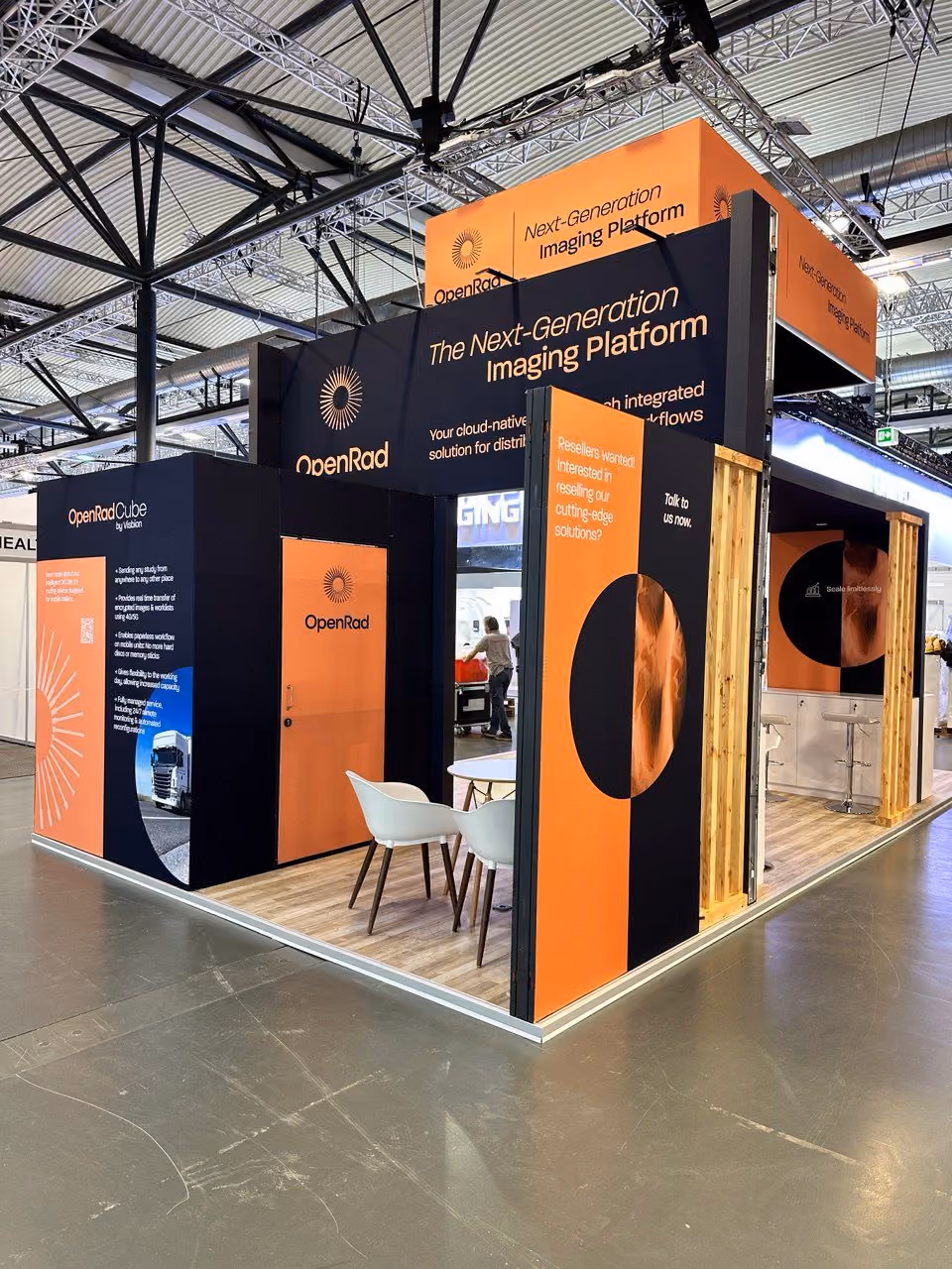 OpenRad exhibition stand with bold orange and black branding