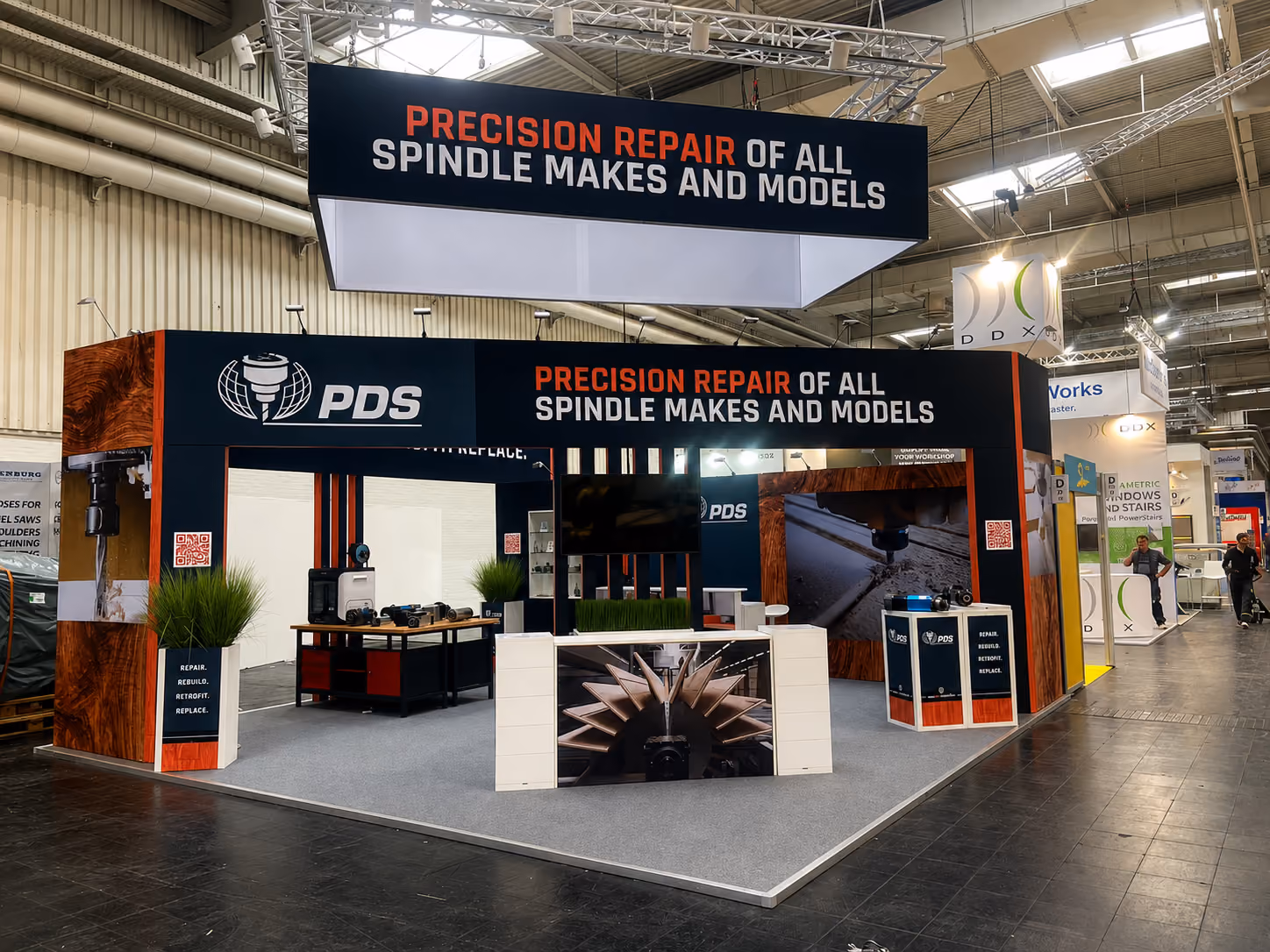 PDS exhibition stand design with branded reception and open meeting space