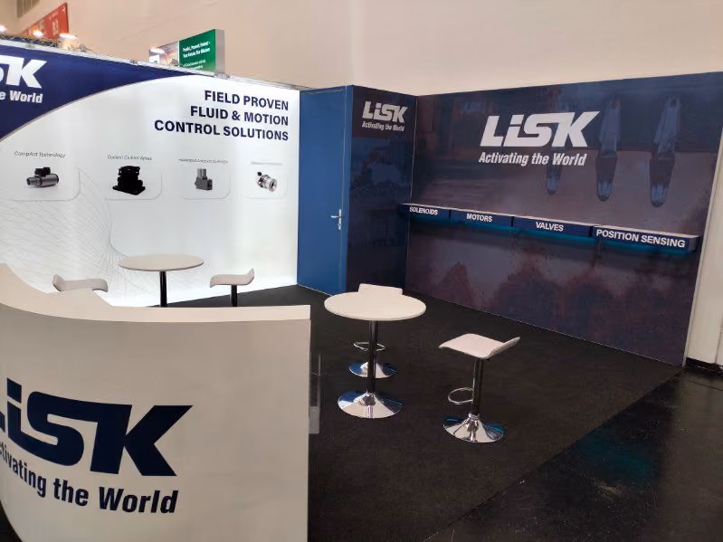 LSK exhibition stand design with branded walls and meeting area