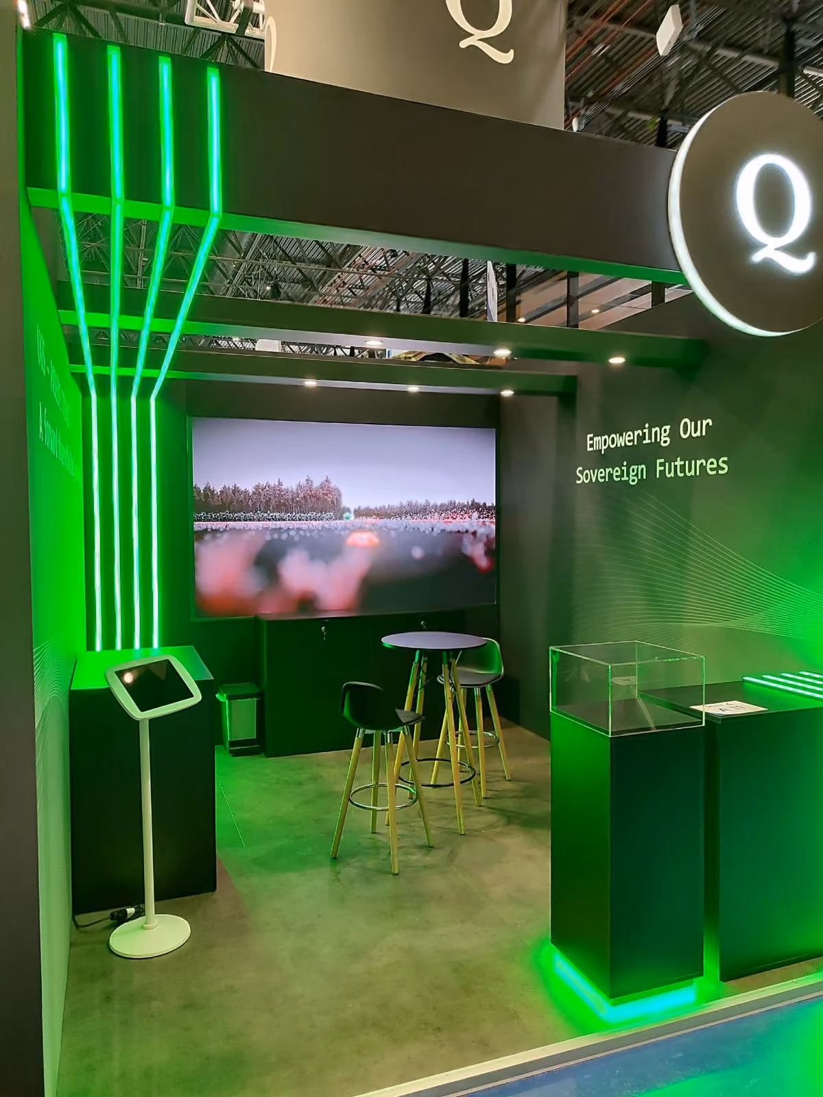 	Green LED-lit technology exhibition stand design with branded video wall