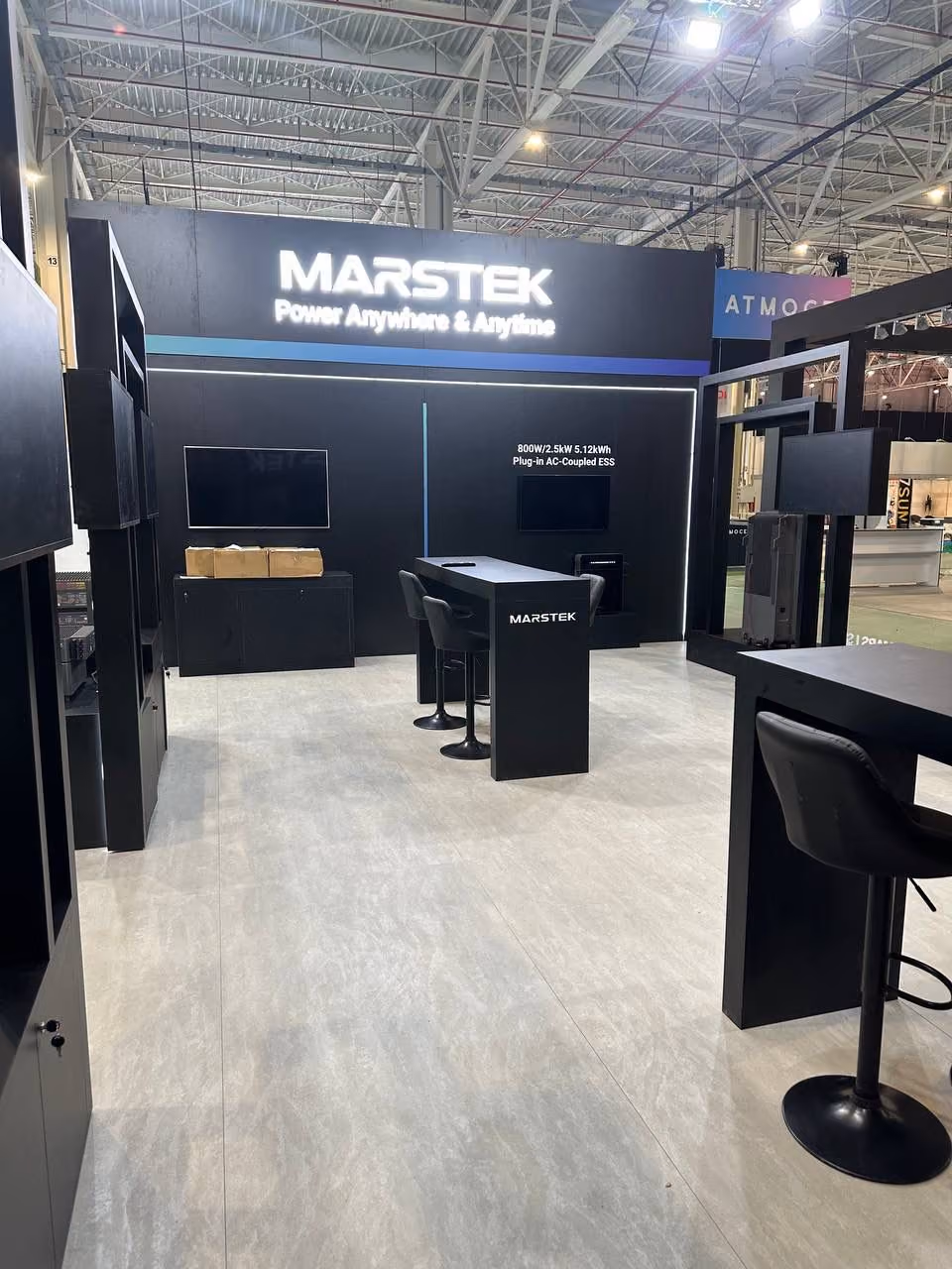 Marstek exhibition stand design with black modular display units