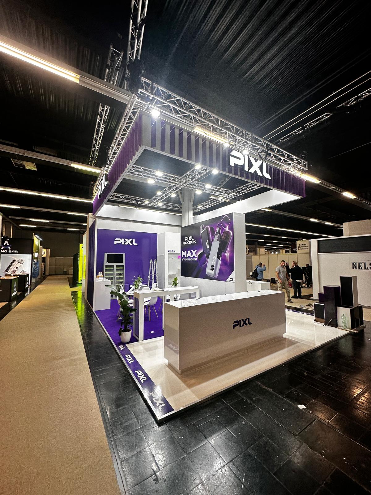 PIXL exhibition stand with purple and white branding and illuminated overhead signage
