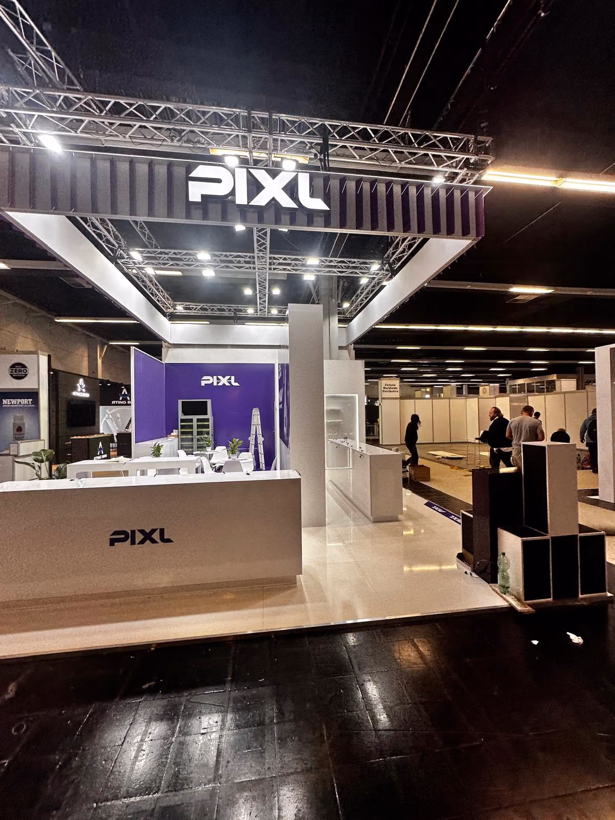 PIXL custom exhibition stand with purple and white branding
