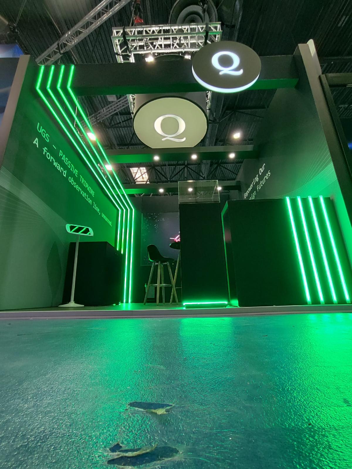 Green-Q-T exhibition stand with illuminated green display environment