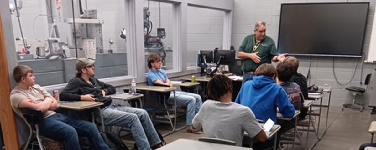 Mid-America Machine Director of Sales Joe Venice speaking to ATC machine tool students during a Power in Partnership classroom visit