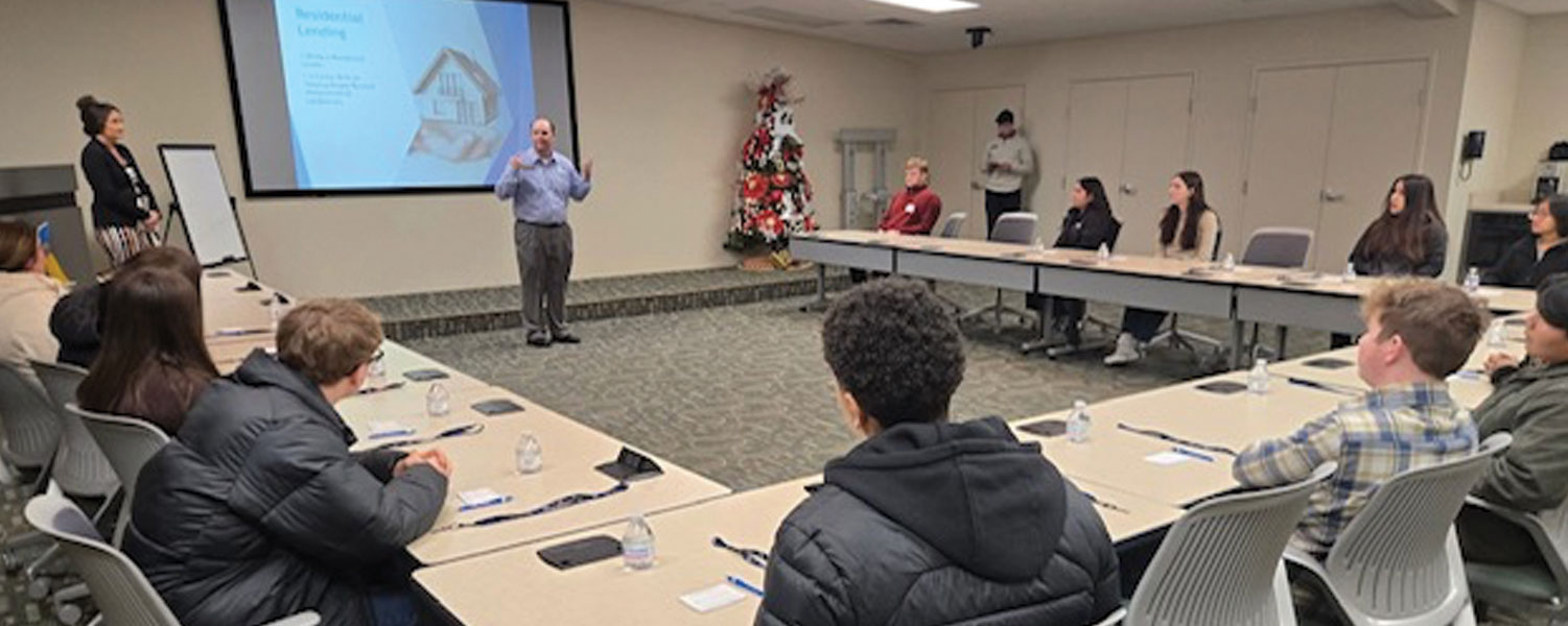 A local bank representative presenting career opportunities to ATC accounting students during a Power in Partnership business tour