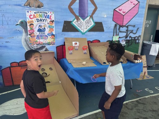 Two students playing carnival games at school Carnival Day event