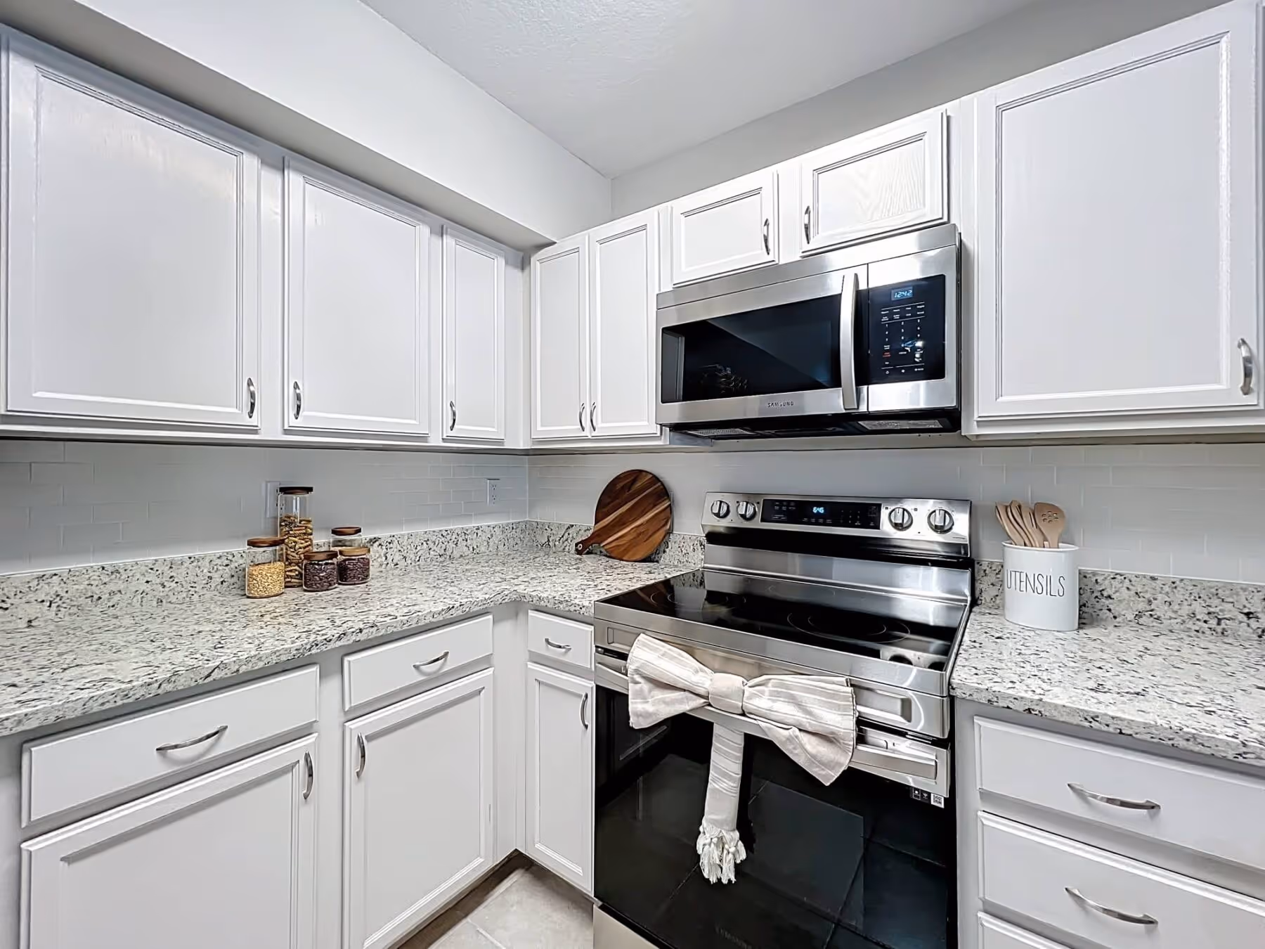 Kitchen with white cabinets and stainless steel appliances