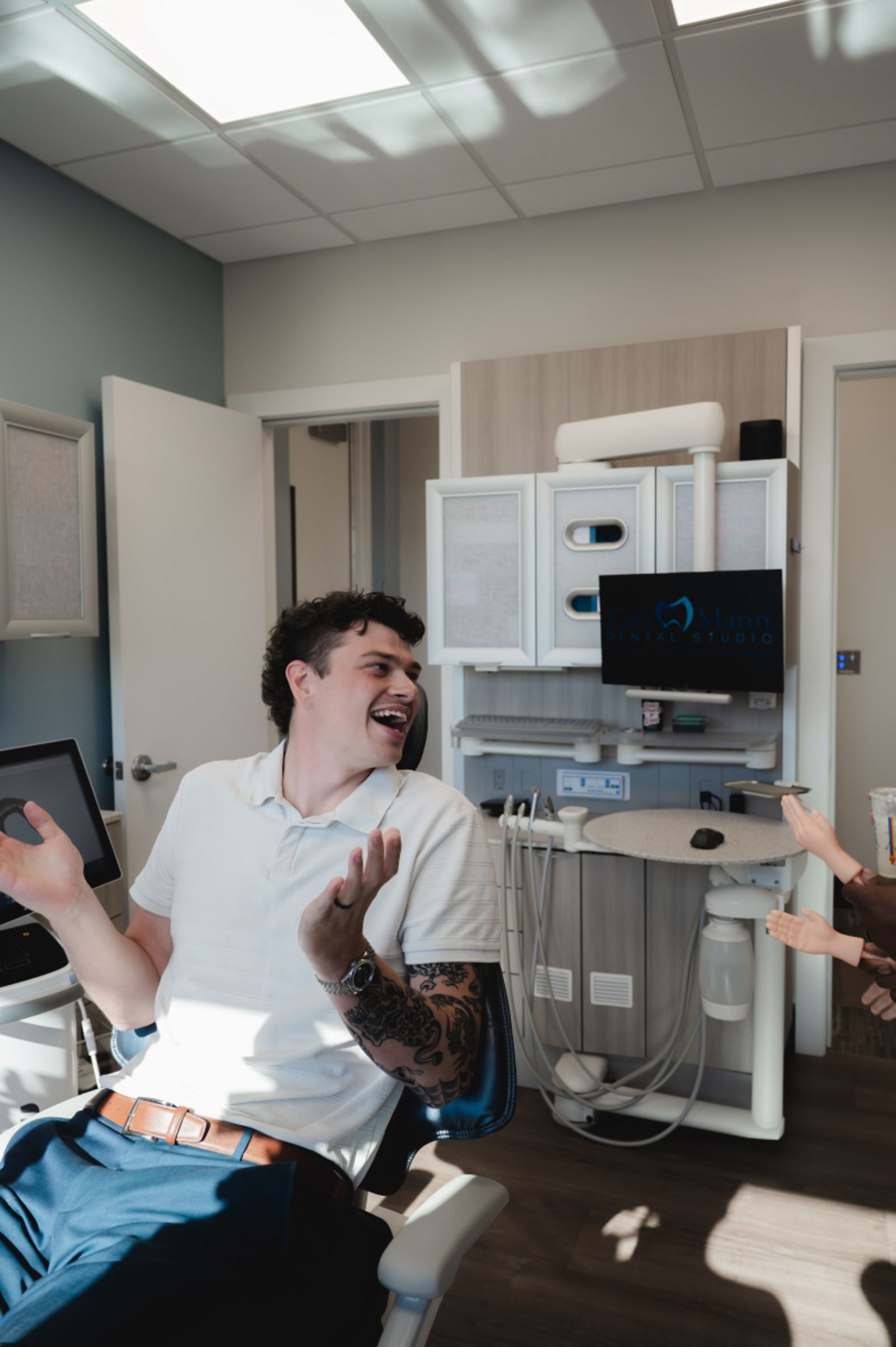 Dental professional examining advanced sedation equipment in a modern operatory at Kari Mann Dental Studio.