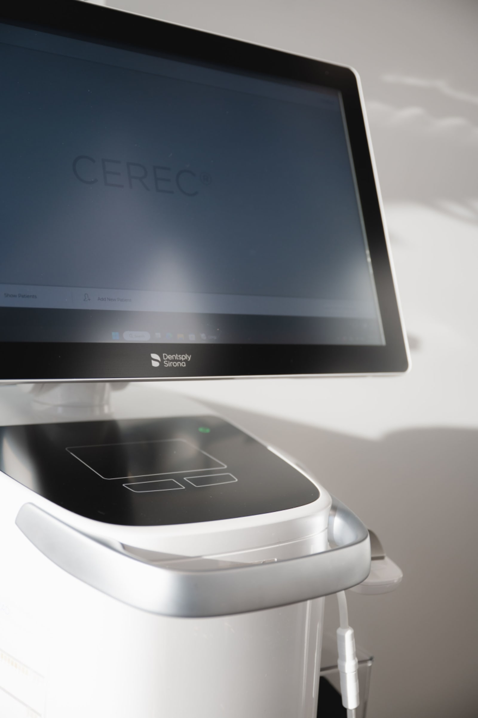 Advanced dental imaging technology and computer display showing digital treatment planning