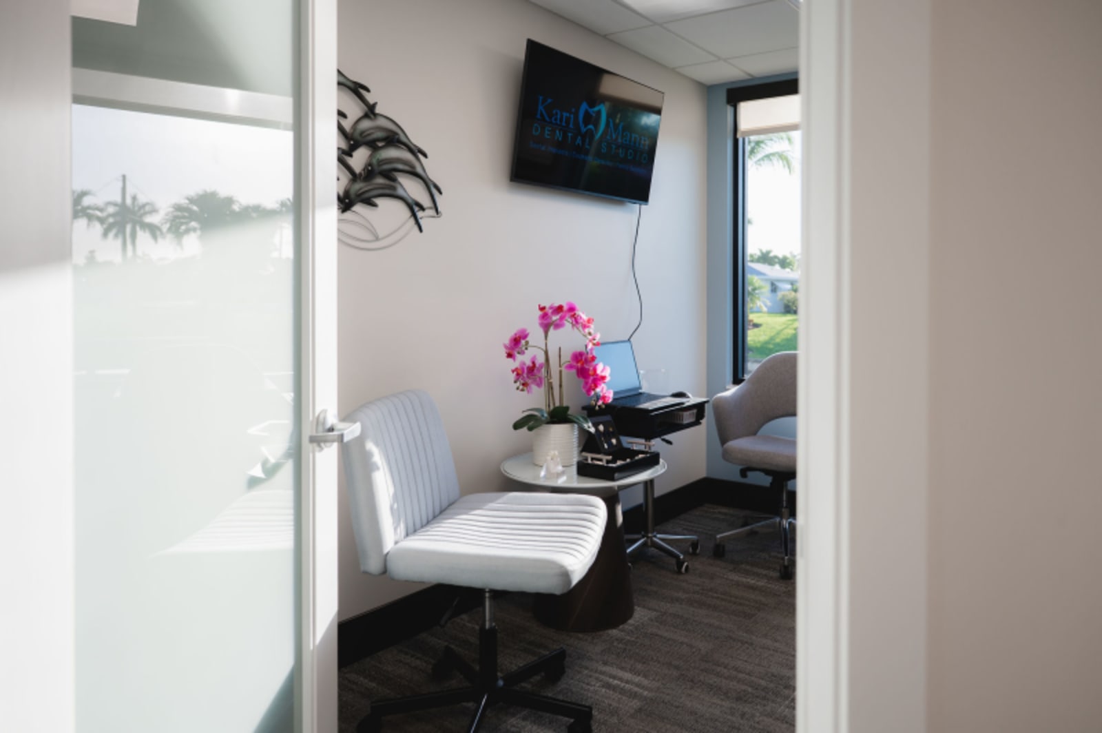 Modern dental operatory with pink flowers showing Kari Mann Dental Studio treatment room