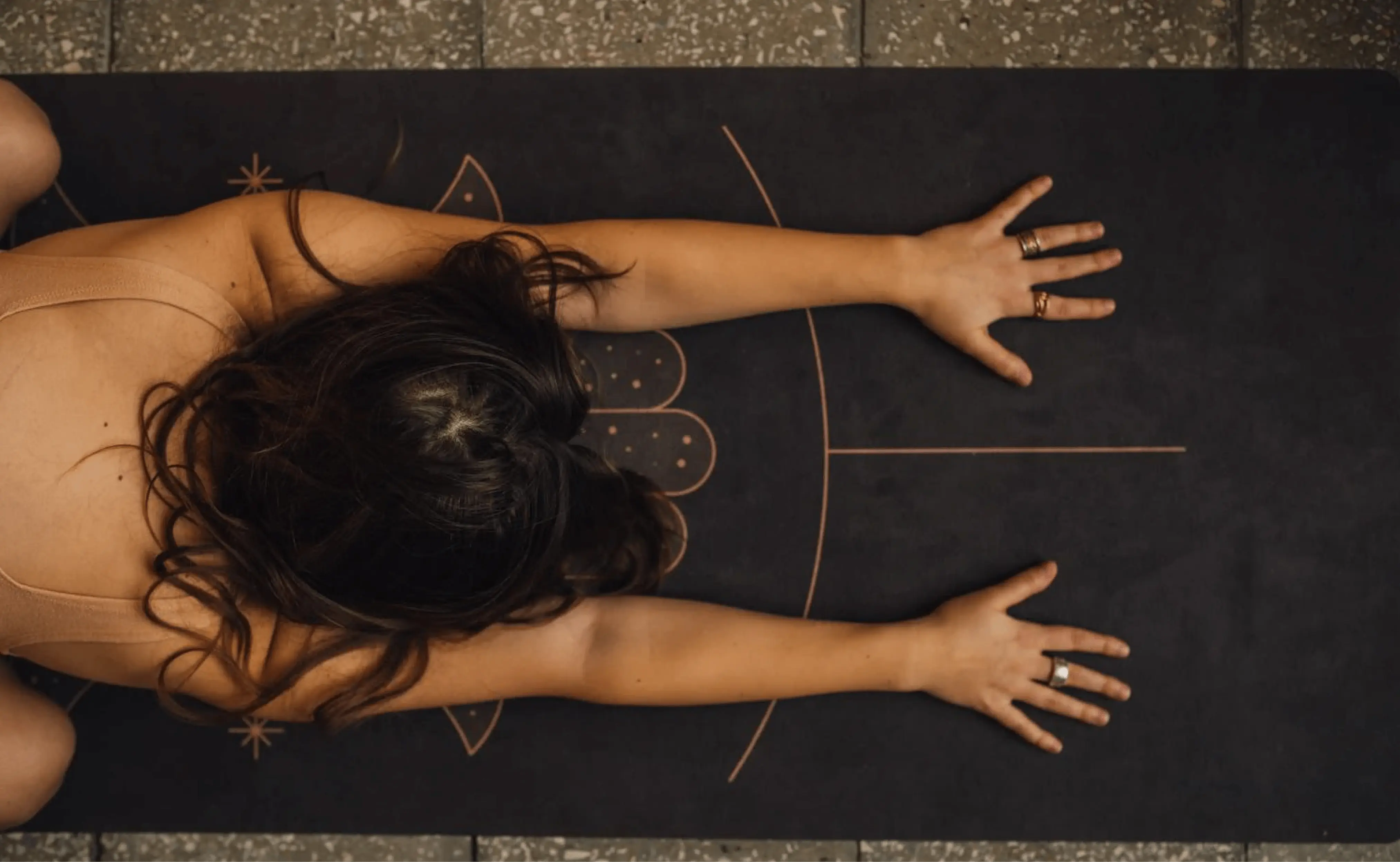 A woman practicing yoga on the yoga mat