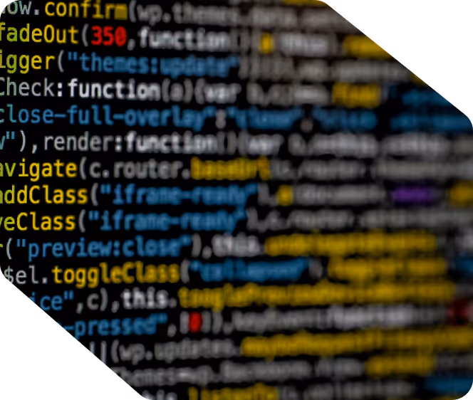 Blurred close-up of colorful JavaScript code on a dark screen.