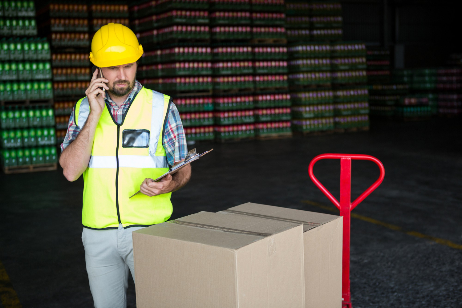  Warehouse staff reviewing shipment paperwork to ensure customs compliance for brands during import operations.
