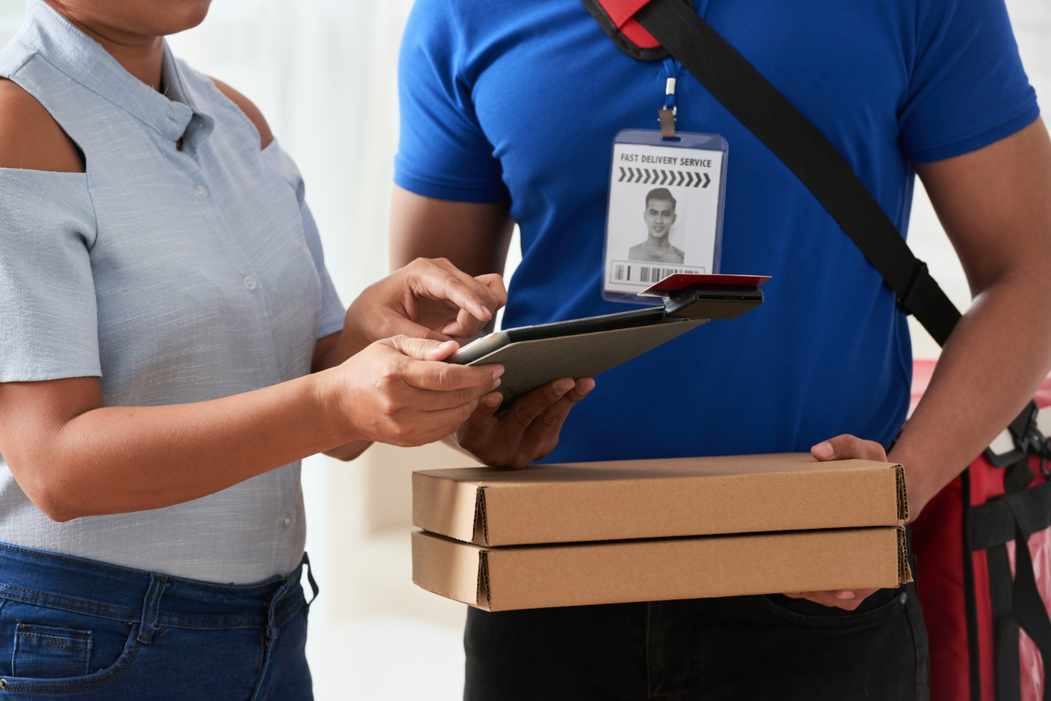 Customer confirming delivery with a digital signature to avoid import penalties and ensure compliance.