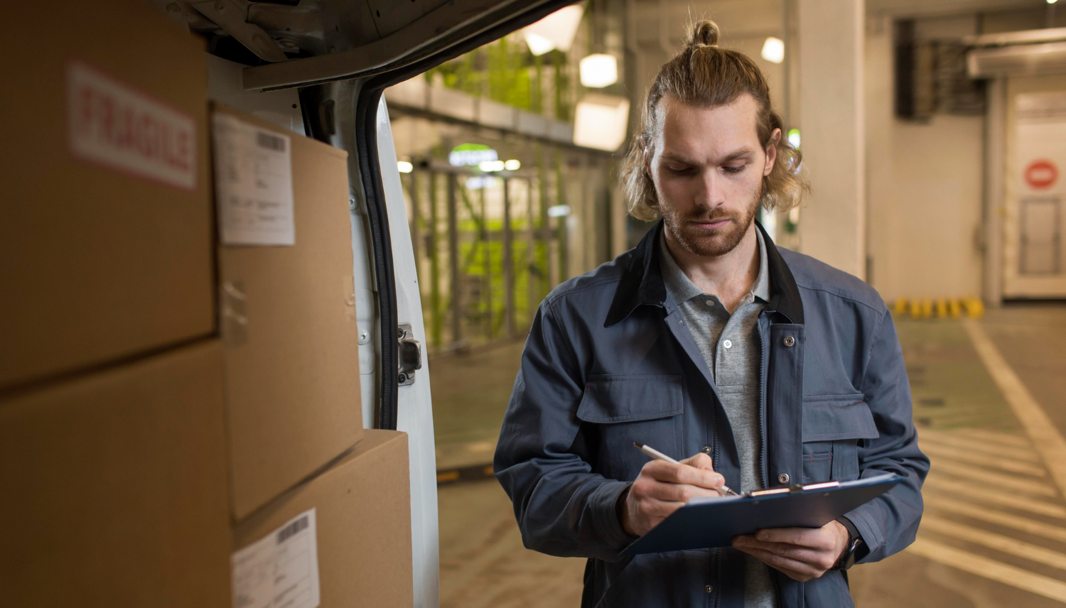 Worker checking documents for international shipping compliance.