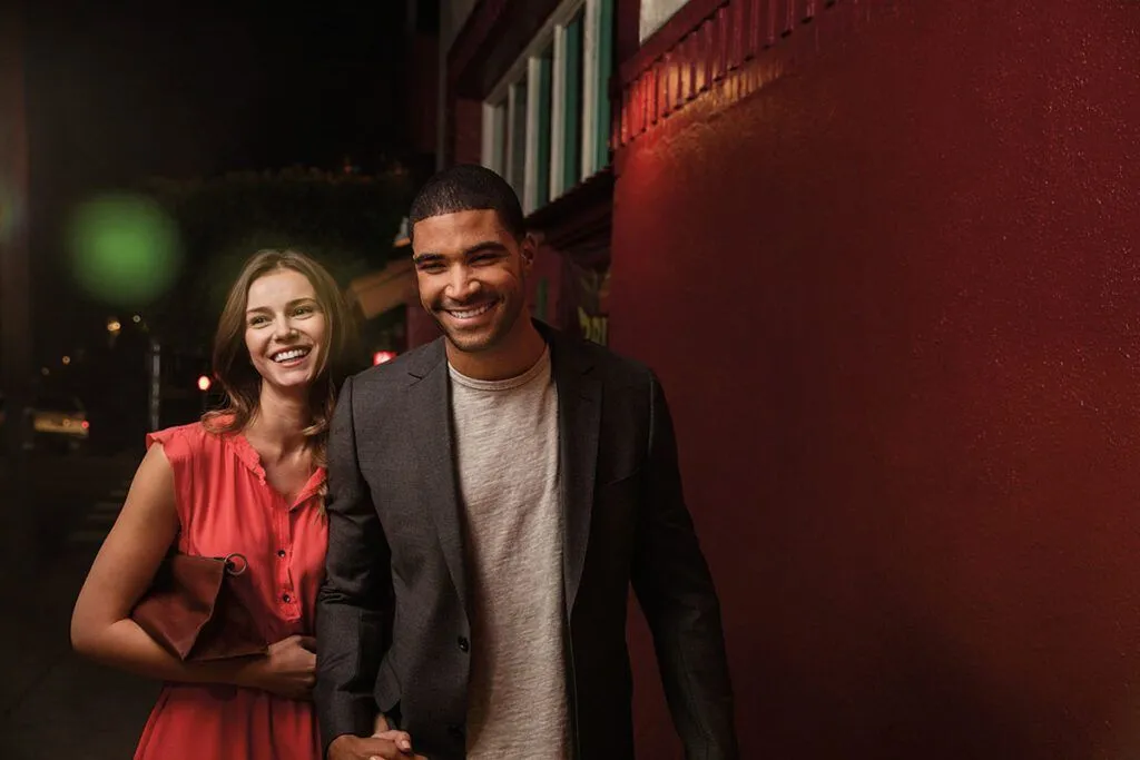 Smiling adult couple outdoors