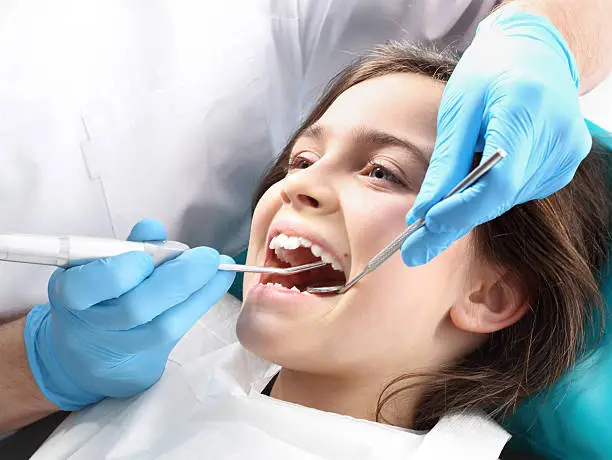 Young girl having an orthodontic examination