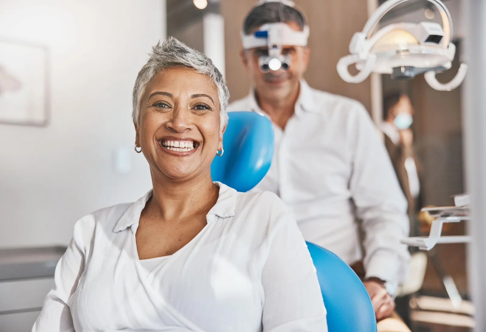 Patient smiling after TMD pain treatment