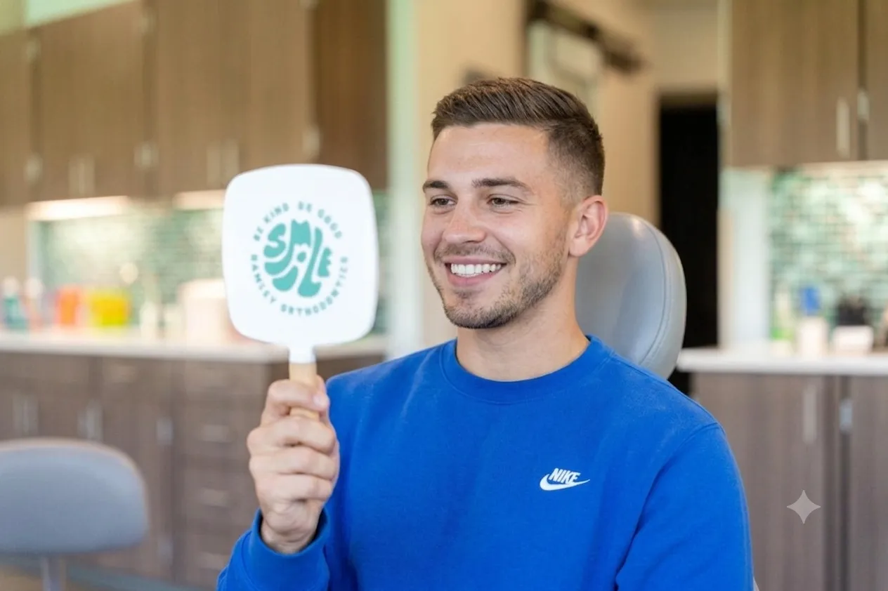 Happy patient reviewing crossbite correction results at Kendrick Orthodontics in Kissimmee, FL