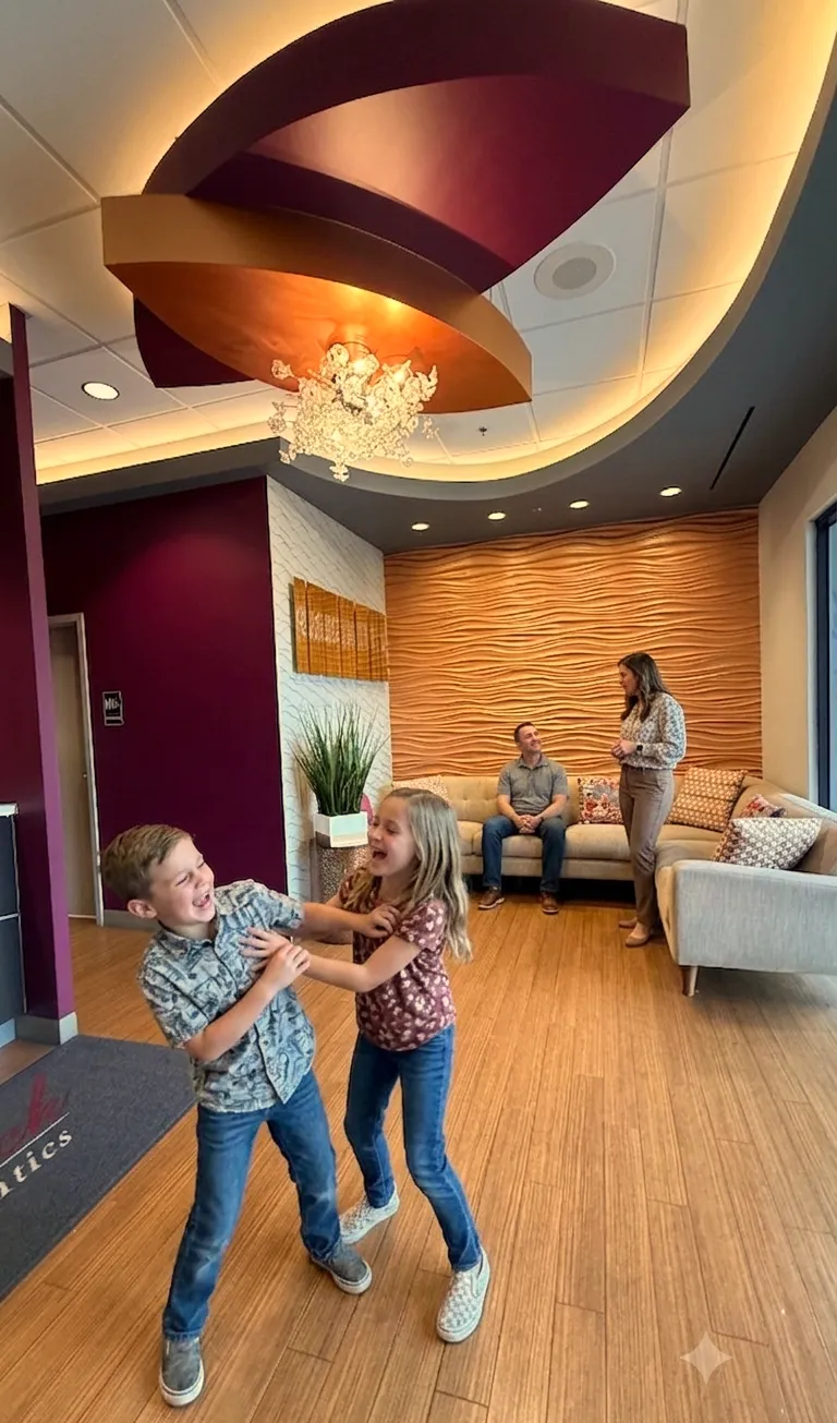 Children playing in the Kendrick Orthodontics waiting area