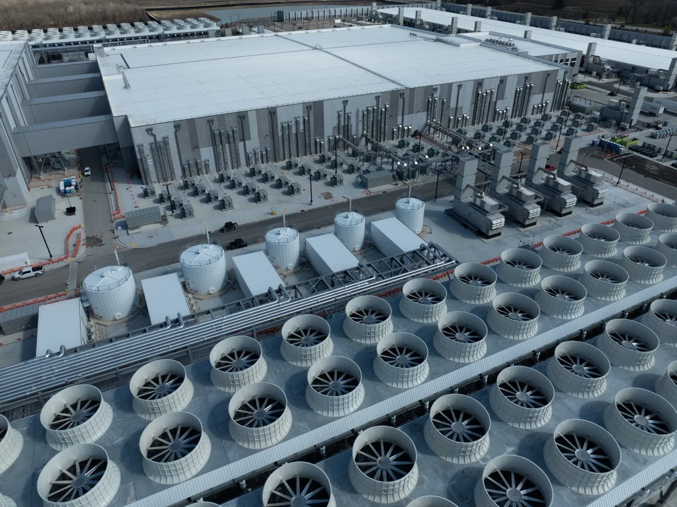 Rooftop of an industrial building covered with rows of cooling-fan units