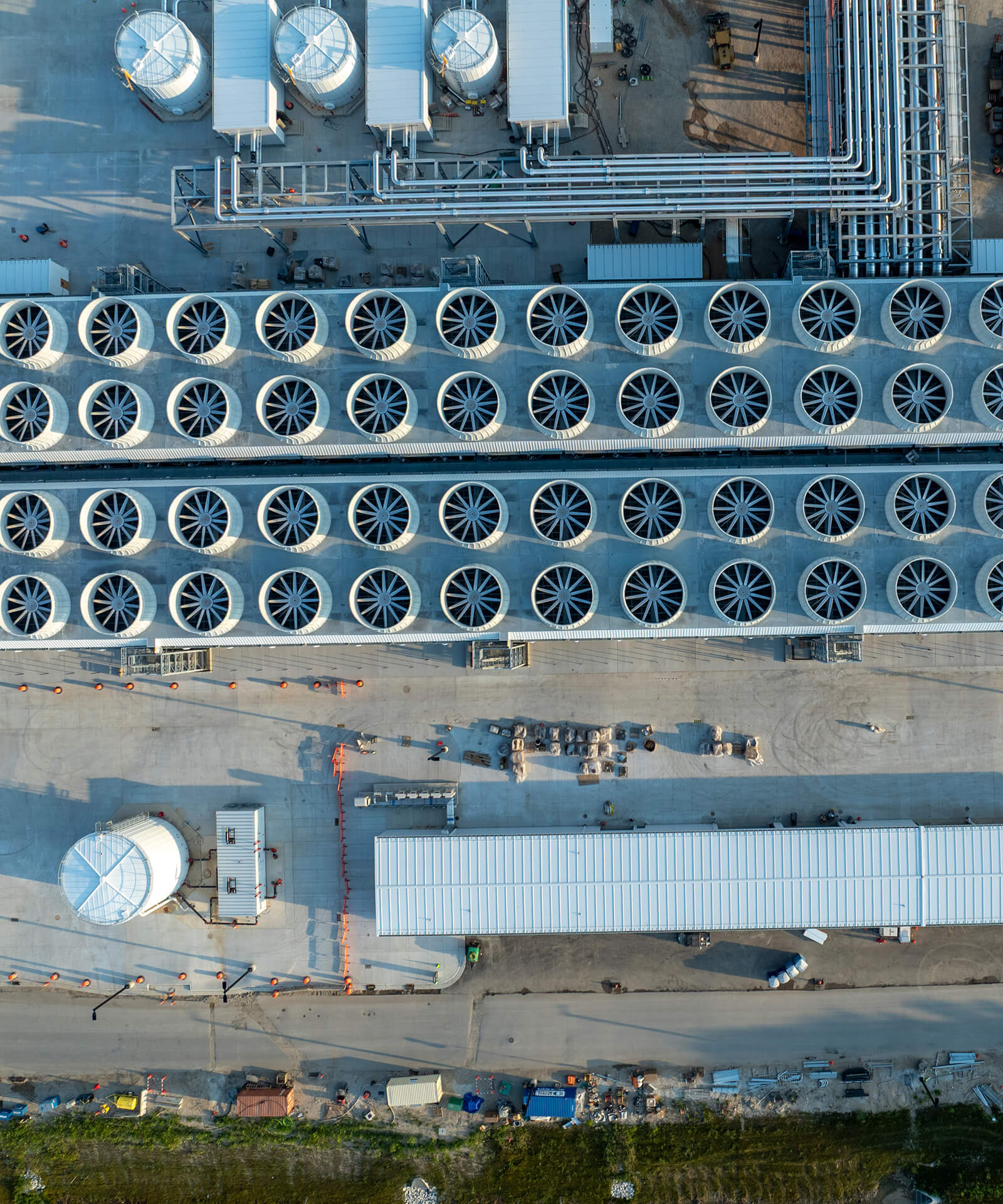 Aerial view of a data centre rooftop lined with circular cooling units
