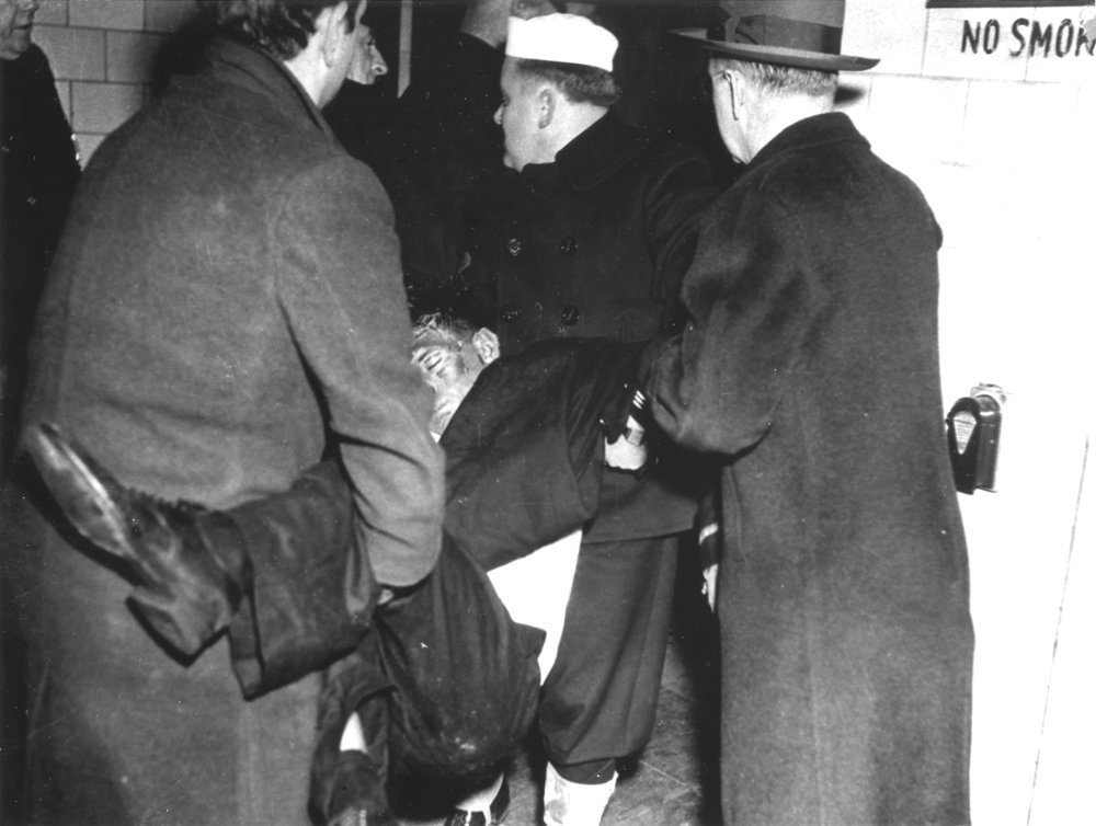 People helping other patrons out of the building