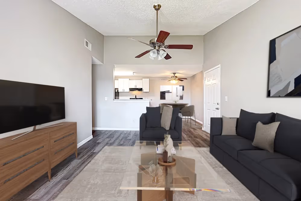 View of Living area with virtual staged furniture including tv, coffee table, and sofa