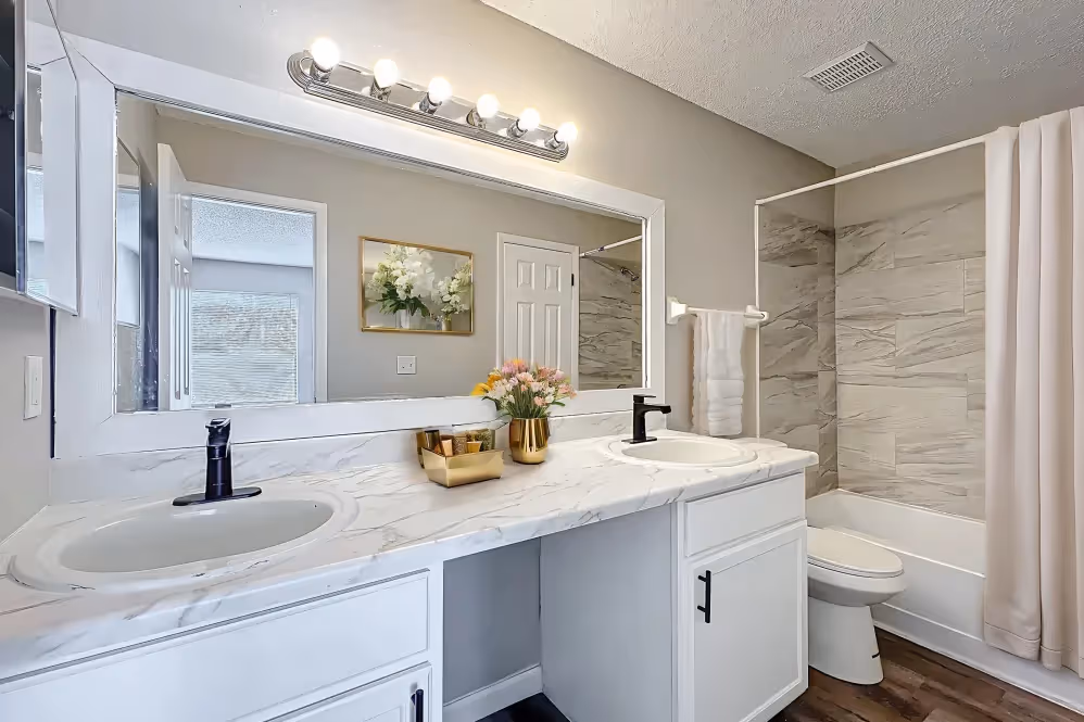 Bathroom with tub with shower curtain