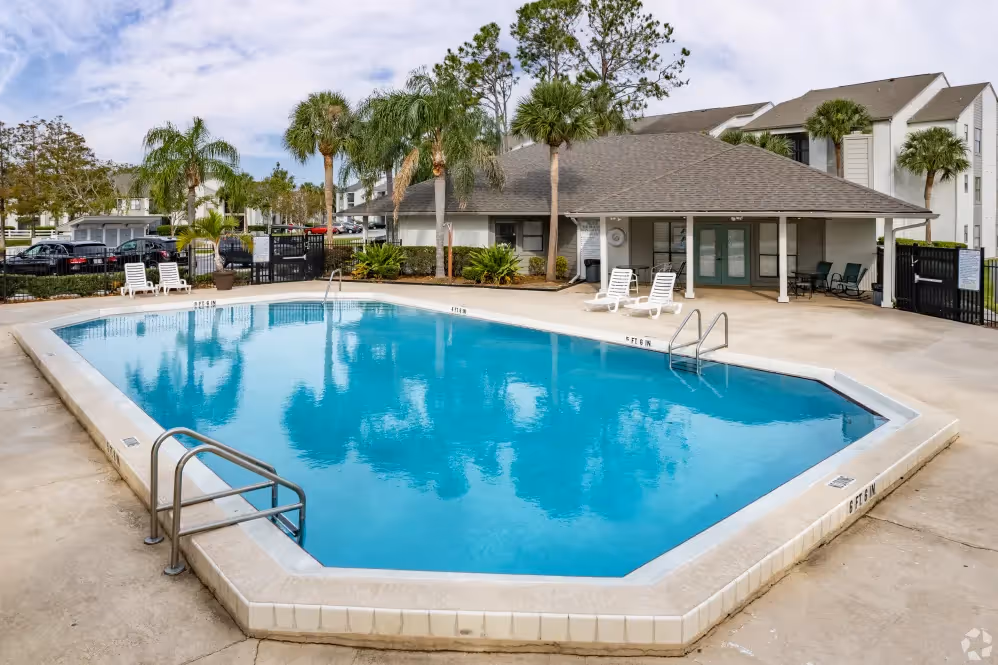 Swimming pool with view of exterior and trees
