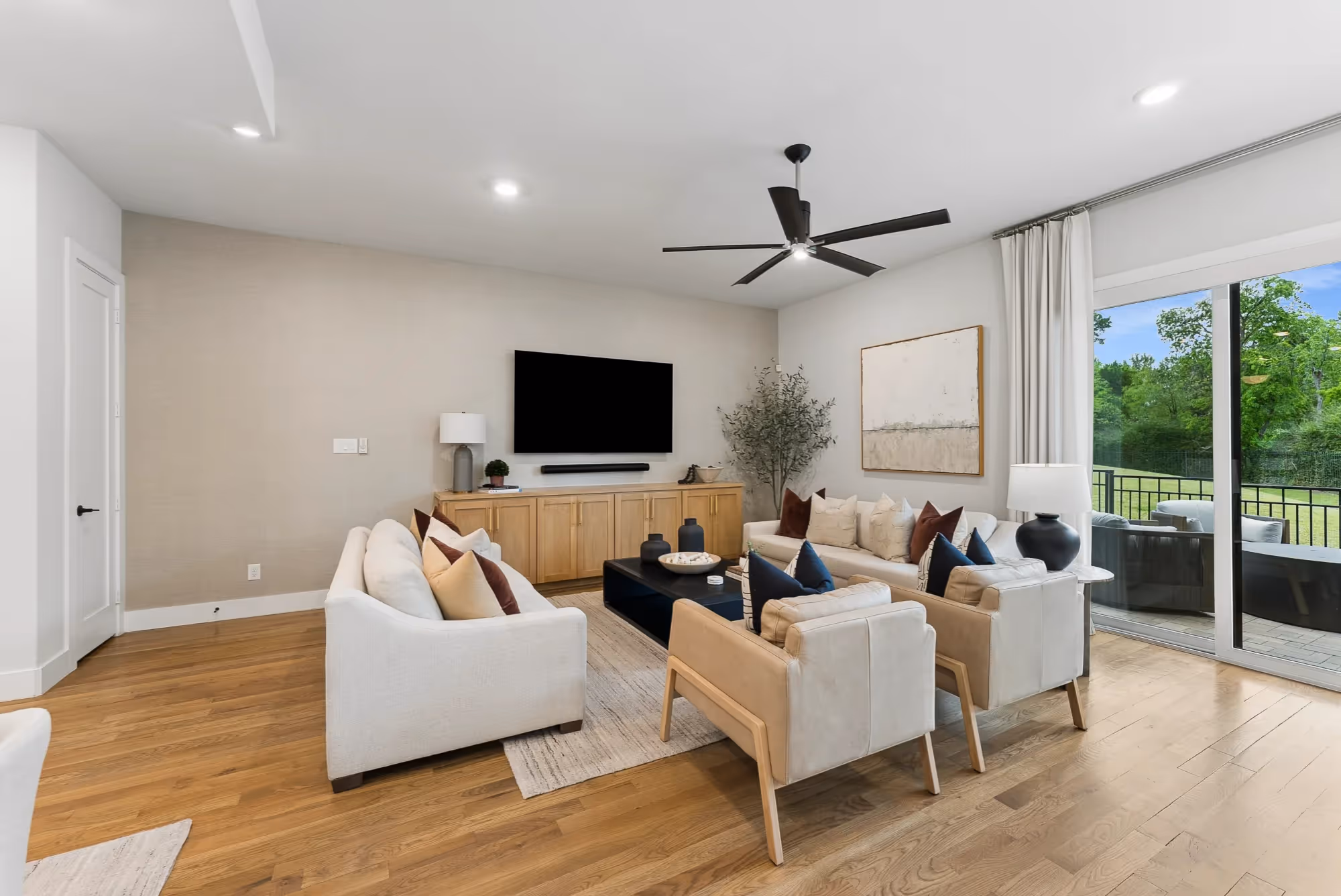 Bright living room with seating and TV