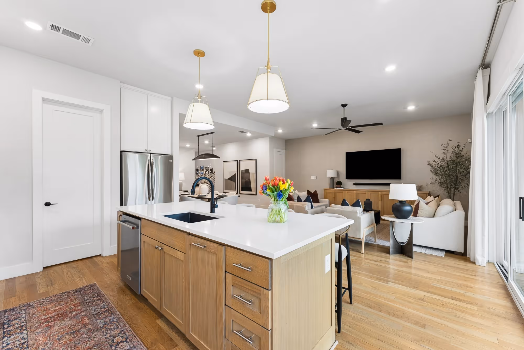 Modern kitchen with island opening to living area