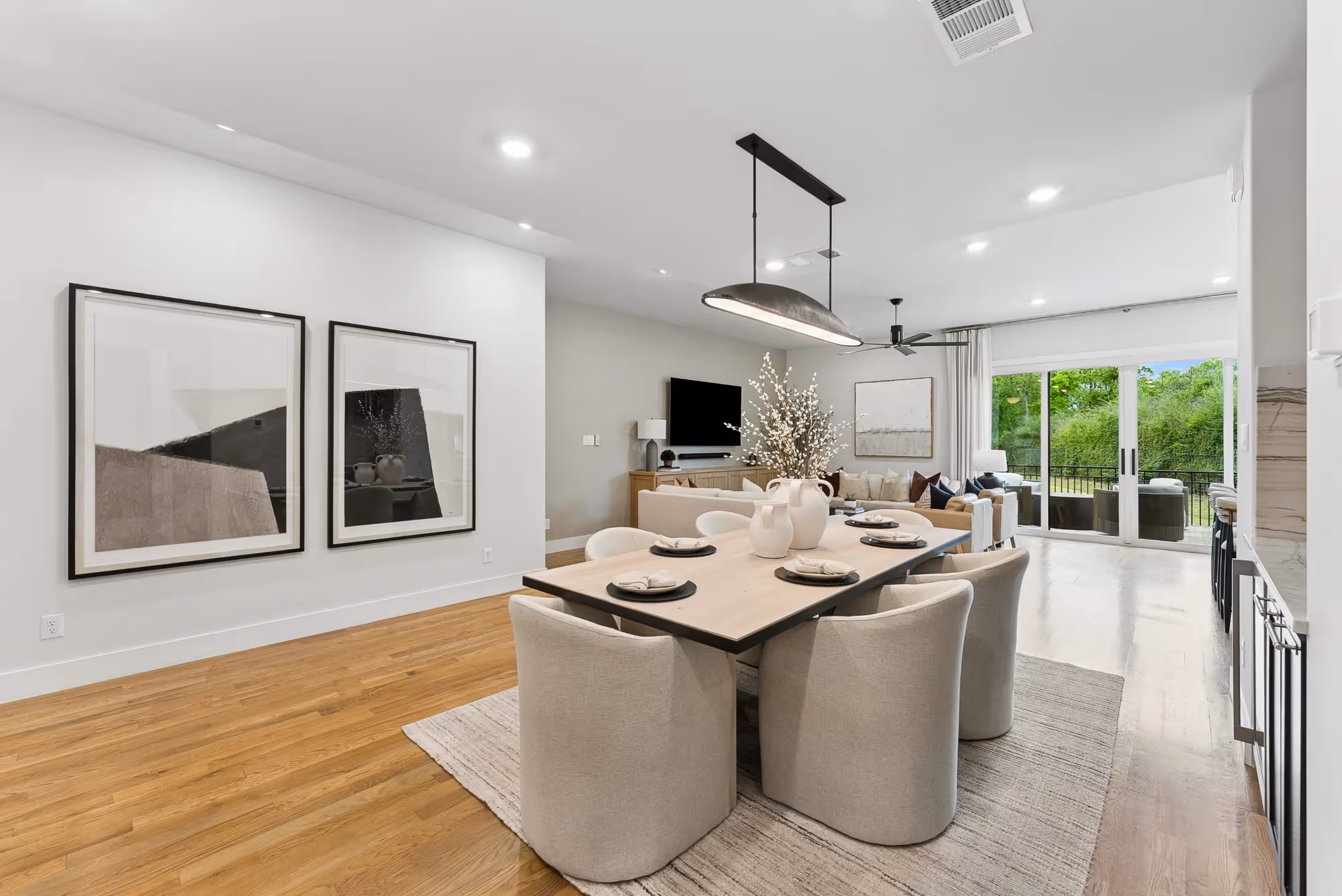 Open-plan living and dining area with sofa and sliding doors